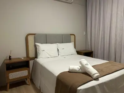 Uma cama ou camas num quarto em Achei Itapema • Mariluz Residencial, R.269