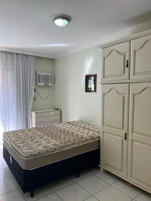 Uma cama ou camas num quarto em Apartamento lateral mar no centro da Meia Praia