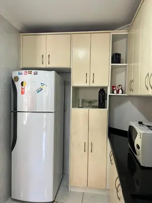 A cozinha ou kitchenette de Apartamento lateral mar no centro da Meia Praia