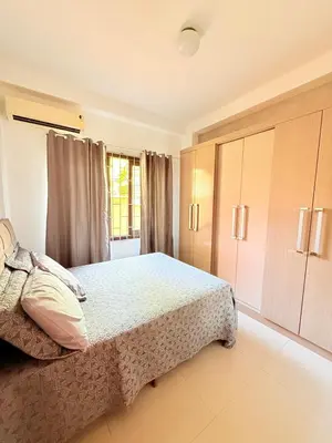 Uma cama ou camas num quarto em Casa com Piscina em Bombinhas