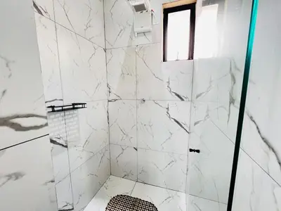 Uma casa de banho em Casa com Piscina em Bombinhas