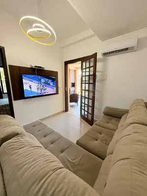 Uma área de estar em Casa com Piscina em Bombinhas