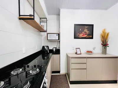 A cozinha ou kitchenette de Casa com Piscina em Bombinhas