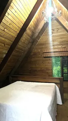 Uma cama ou camas num quarto em Sitio com vista panorâmica