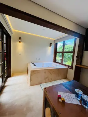 Uma cama ou camas num quarto em Studio com Jacuzzi na Natureza Casal Baoba Suite