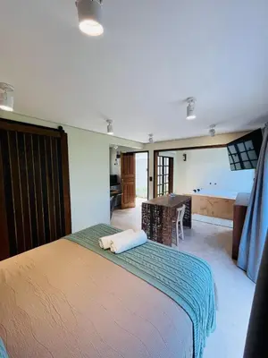 Uma cama ou camas num quarto em Studio com Jacuzzi na Natureza Casal Baoba Suite