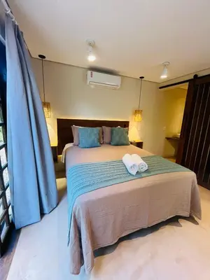 Uma cama ou camas num quarto em Studio com Jacuzzi na Natureza Casal Baoba Suite