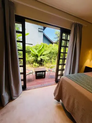 Uma cama ou camas num quarto em Studio com Jacuzzi na Natureza Casal Baoba Suite