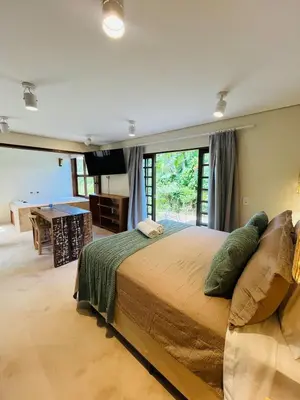 Uma cama ou camas num quarto em Studio com Jacuzzi na Natureza Casal Baoba Suite
