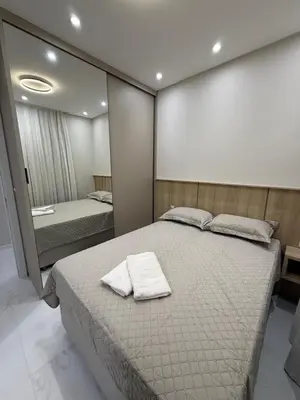 Uma cama ou camas num quarto em Apartamento Novo e lindo! Próximo Mar e Shopping