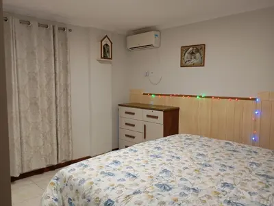 Uma cama ou camas num quarto em balneário a melhor do brasil