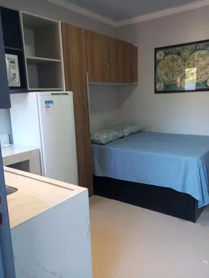 Uma cama ou camas num quarto em kitnet 4