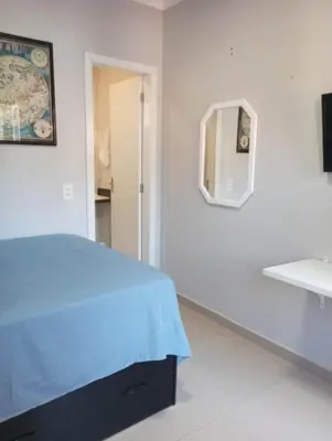 Uma cama ou camas num quarto em kitnet 4
