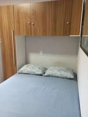 Uma cama ou camas num quarto em kitnet 4