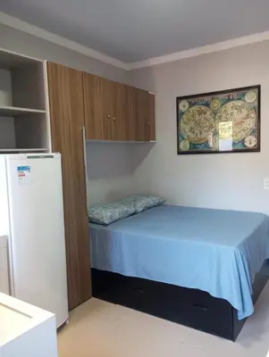 Uma cama ou camas num quarto em kitnet 4