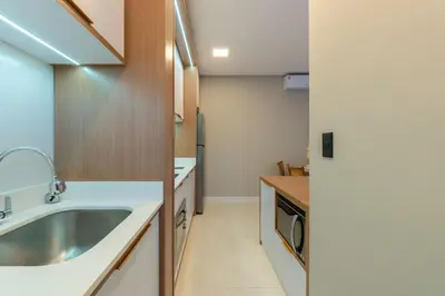 A cozinha ou kitchenette de Apartamento alto padrão com 2 suites e piscina