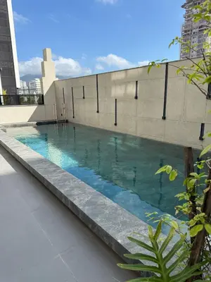 A piscina em ou perto de Lindo Flat na rua da Praia - Meia Praia Itapema