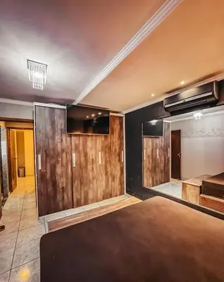 Uma cama ou camas num quarto em Casa aconchegante em Itapema com piscina