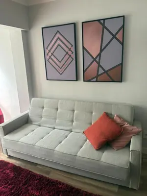 Uma área de estar em Apartamento completo, 2 quartos e estacionamento