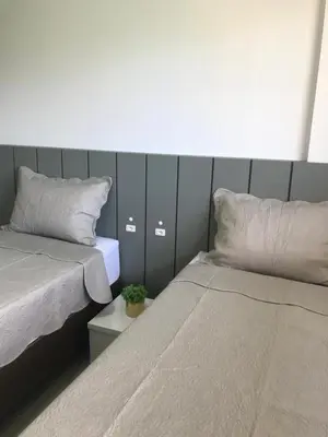 Uma cama ou camas num quarto em Apto alto padrão - 001A