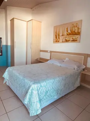 Uma cama ou camas num quarto em Vista Mar Praia da Lagoinha - Residencial Pé na Areia