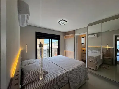 Uma cama ou camas num quarto em Apartamento na praia de Palmas com vista para o Mar