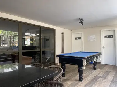 A sala de jogos em Spazio di Palmas 203B - Apartamento no centro de Palmas, a poucos metros do mar.