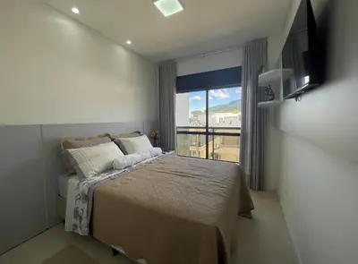 Uma cama ou camas num quarto em Spazio di Palmas 203B - Apartamento no centro de Palmas, a poucos metros do mar.