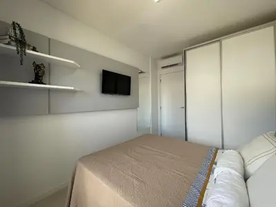 Uma cama ou camas num quarto em Spazio di Palmas 203B - Apartamento no centro de Palmas, a poucos metros do mar.