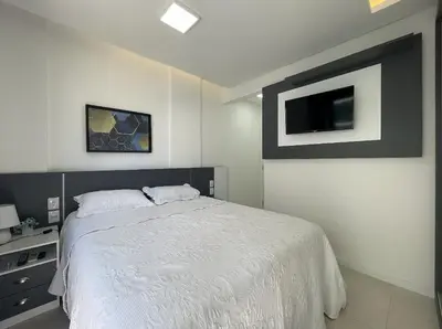 Uma cama ou camas num quarto em Spazio di Palmas 203B - Apartamento no centro de Palmas, a poucos metros do mar.
