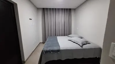 Uma cama ou camas num quarto em Residencial da Vila Apartamento 1