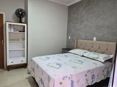 Uma cama ou camas num quarto em Casinha Encantada da MaLu