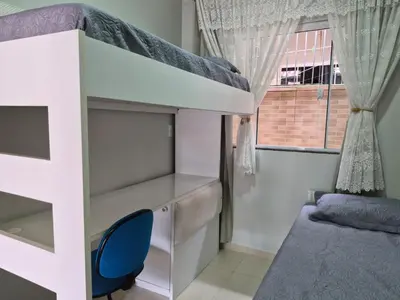 Uma cama ou camas num quarto em Casinha Encantada da MaLu