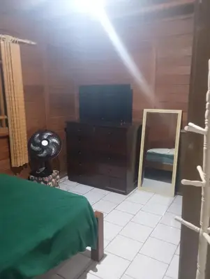 Uma televisão e/ou sistema de entretenimento em Casa de Praia