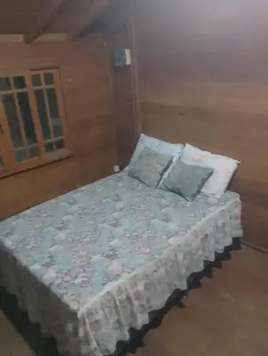 Uma cama ou camas num quarto em Casa de Praia