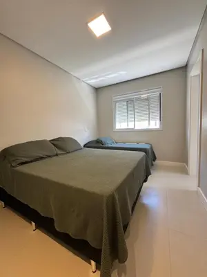 Uma cama ou camas num quarto em Green Home Palmas