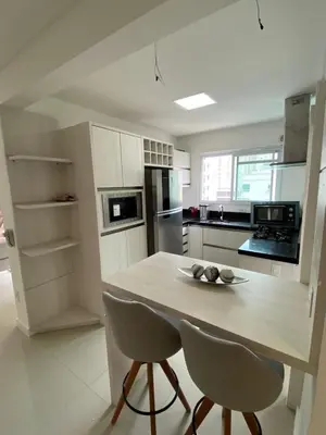 A cozinha ou kitchenette de Apartamento Tamanho Família