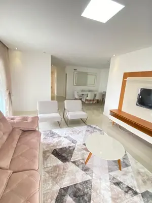 Uma área de estar em Apartamento Tamanho Família