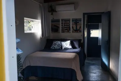 Uma cama ou camas num quarto em Casa A-Mar-Elos 500m Praia Estaleirinho
