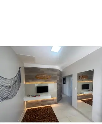 Uma televisão e/ou sistema de entretenimento em Casa de praia em palmas