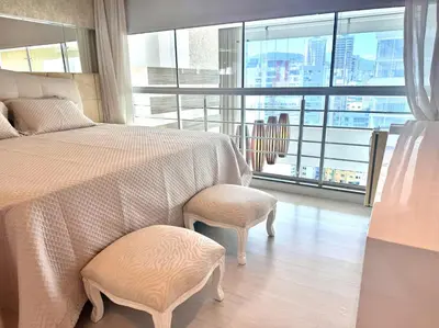Uma cama ou camas num quarto em Cobertura Duplex com Banheira