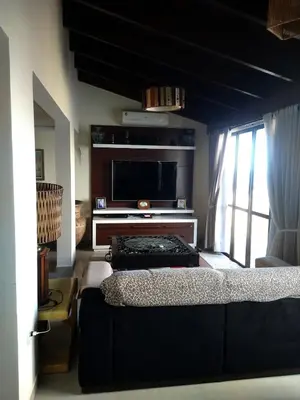 Uma cama ou camas num quarto em Cobertura com piscina e vista do mar