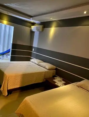 Uma cama ou camas num quarto em Casa Flores TÉRREA