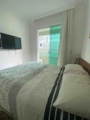 Uma cama ou camas num quarto em Casa com piscina a 400m da praia de Palmas