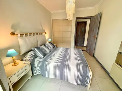 Uma cama ou camas num quarto em Apartamento do Sol - Alto padrão, piscina, 3 quartos, 220m da praia no centro de Bombinhas