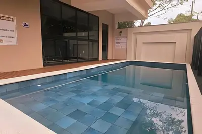A piscina em ou perto de Confortável Apartamento na Praia de Bombinhas