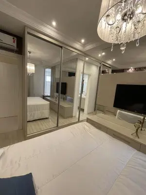 Uma cama ou camas num quarto em Apartamento 3 suítes rua 226 na Meia Praia