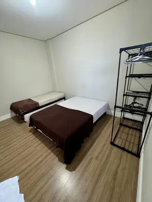 Uma cama ou camas num quarto em 2 suítes, 2 garagens proximo ao HardRock Cafe Itapema
