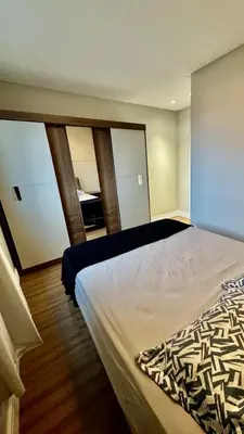 Uma cama ou camas num quarto em 2 suítes, 2 garagens proximo ao HardRock Cafe Itapema