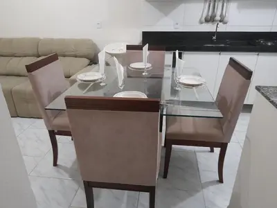 Uma área de estar em Apto em Tijucas compartilhado